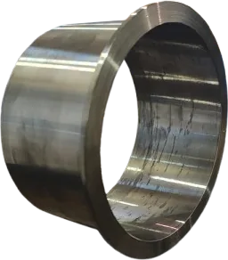 A machined brass component of the kind Absan re-engineers in polymer